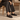 Mocassins Billi bi noirs en cuir athène artisanal avec semelle cousue, portés avec un pantalon gris