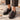 Mocassins artisanaux Billi bi couleur mogano en cuir athène avec semelle cousue, portés sur un sol pavé