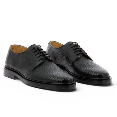 Chaussures noires Bobbies en cuir tressé artisanal, fabriquées au Portugal.