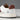 Détail du talon de la basket artisanale Court 2.0 vintage moodeshop en cuir et daim blanc, bordeaux et beige.