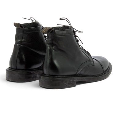 Boots à lacets artisanales moodeshop en cuir vachetta noir avec semelle cousue et talon bas