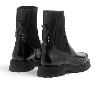 Boots Maison toufet Janelle en cuir glacé noir avec tige élastique et semelle crantée, vendues par moodeshop