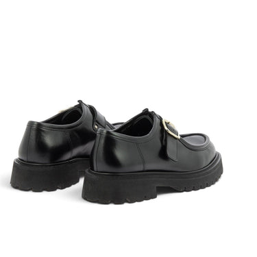 Mocassins à boucle Maison toufet en cuir glacé noir avec semelle crantée, vendus par moodeshop